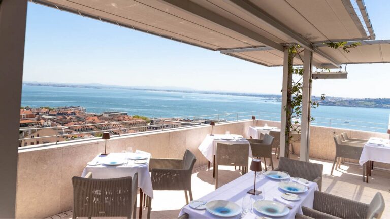 Scenic outdoor restaurant tables on the panoramic rooftop at Verride Santa Catarina Lisbon
